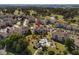 Aerial view showcasing condo location near a golf course, community pool, parking and common grounds at 4749 Wild Iris Dr. # 205, Myrtle Beach, SC 29577