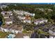 Sprawling aerial view showcases community with pools, lush greenery and condo buildings at 4749 Wild Iris Dr. # 205, Myrtle Beach, SC 29577