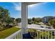 Condo balcony offers views of the grounds and palm trees from the porch at 4749 Wild Iris Dr. # 205, Myrtle Beach, SC 29577