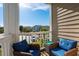 Chairs and a table provide a comfy spot on this balcony overlooking the complex at 4749 Wild Iris Dr. # 205, Myrtle Beach, SC 29577