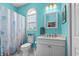 Bright bathroom features white vanity, marble top, and arched window for a fresh, clean aesthetic at 4749 Wild Iris Dr. # 205, Myrtle Beach, SC 29577