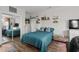 Comfortable bedroom with a mirrored closet door, ceiling fan, and decor shelving at 4749 Wild Iris Dr. # 205, Myrtle Beach, SC 29577