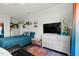 Bright bedroom showcases hardwood floors, a queen bed, a flatscreen TV, and colorful accents throughout at 4749 Wild Iris Dr. # 205, Myrtle Beach, SC 29577