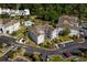 Aerial view of condo buildings with convenient parking, mature trees and landscaping at 4749 Wild Iris Dr. # 205, Myrtle Beach, SC 29577