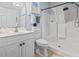 This well-lit bathroom features a shower, sleek vanity, and ample towel storage for a fresh and inviting space at 4803 Bovardia Pl. # 104, Myrtle Beach, SC 29577