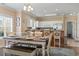 Well-lit dining room with stylish table set and a view to the modern kitchen at 4803 Bovardia Pl. # 104, Myrtle Beach, SC 29577