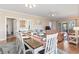 Open dining area leading to cozy living room with stylish furnishings at 4803 Bovardia Pl. # 104, Myrtle Beach, SC 29577