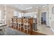 Charming kitchen features white cabinets, stainless steel appliances, and bar seating at 4803 Bovardia Pl. # 104, Myrtle Beach, SC 29577