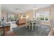 Spacious living space with dining area featuring hardwood floors and ample natural light at 4803 Bovardia Pl. # 104, Myrtle Beach, SC 29577