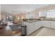 Inviting living space seamlessly connects to the kitchen, showcasing open-concept design and natural light at 4803 Bovardia Pl. # 104, Myrtle Beach, SC 29577
