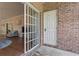 The brick patio features a sliding glass door to the interior, and a door to the exterior, offering easy access at 4803 Bovardia Pl. # 104, Myrtle Beach, SC 29577