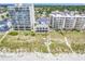 Aerial view of a hotel and condos on the beach with a wooden walk-way from the buildings to the sand at 4814 Greenhaven Dr., North Myrtle Beach, SC 29582