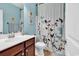Bathroom featuring a sink, toilet, and a decorative shower curtain at 4814 Greenhaven Dr., North Myrtle Beach, SC 29582