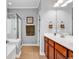 Bathroom featuring a glass door shower, and a wood vanity at 4814 Greenhaven Dr., North Myrtle Beach, SC 29582
