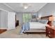 Bedroom featuring a ceiling fan, window, and wooden furniture at 4814 Greenhaven Dr., North Myrtle Beach, SC 29582