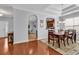 Dining area featuring hardwood floors, stylish lighting, and seamless flow to the kitchen at 4814 Greenhaven Dr., North Myrtle Beach, SC 29582