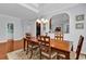 Dining room with hardwood floors, decorative lighting, and open to living areas at 4814 Greenhaven Dr., North Myrtle Beach, SC 29582