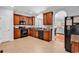 Well-equipped kitchen featuring black appliances, tile backsplash and dark cabinetry at 4814 Greenhaven Dr., North Myrtle Beach, SC 29582