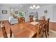 Living room with hardwood floors, ceiling fan, and access to outdoor patio at 4814 Greenhaven Dr., North Myrtle Beach, SC 29582