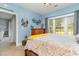 Comfortable bedroom featuring a wooden dresser, soft carpet and natural light at 4847 Carnation Circle # 201, Myrtle Beach, SC 29577