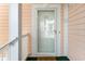 Close-up of the front door with a glass panel allowing light into the unit at 4847 Carnation Circle # 201, Myrtle Beach, SC 29577