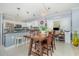 Open-concept kitchen with white cabinets, stainless steel appliances, and view of the dining area at 4847 Carnation Circle # 201, Myrtle Beach, SC 29577