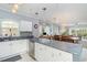 Bright, open kitchen boasts modern appliances and seamlessly flows into a dining area at 4847 Carnation Circle # 201, Myrtle Beach, SC 29577
