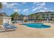 Enjoy a relaxing day at the community pool and sun deck with palm trees at 4847 Carnation Circle # 201, Myrtle Beach, SC 29577