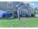 Back yard featuring a well-kept lawn, patio with seating and grill at 503 20Th Ave. N # 15-A, North Myrtle Beach, SC 29582