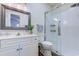 Well-lit bathroom featuring a glass shower, white subway tile, and a vanity with decorative mirror at 503 20Th Ave. N # 15-A, North Myrtle Beach, SC 29582