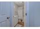 Bright bathroom featuring a single sink vanity and a shower with a white shower curtain at 503 20Th Ave. N # 15-A, North Myrtle Beach, SC 29582