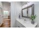 Bathroom vanity with framed mirror and modern lighting at 503 20Th Ave. N # 15-A, North Myrtle Beach, SC 29582