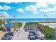 Panoramic view of North Myrtle Beach with palm trees, beachgoers, and clear skies at 503 20Th Ave. N # 15-A, North Myrtle Beach, SC 29582