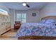 Cozy bedroom featuring a wicker bed frame, ceiling fan, and natural light from the window at 503 20Th Ave. N # 15-A, North Myrtle Beach, SC 29582