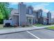 Attractive two-story townhome featuring gray siding, white trim, and colorful landscaping in the front yard at 503 20Th Ave. N # 15-A, North Myrtle Beach, SC 29582