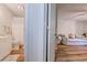 Hallway view from bathroom to a living area with modern flooring and cozy seating at 503 20Th Ave. N # 15-A, North Myrtle Beach, SC 29582