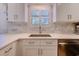 Kitchen area showcasing white cabinets, stainless steel dishwasher and sink at 503 20Th Ave. N # 15-A, North Myrtle Beach, SC 29582