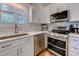Updated kitchen featuring stainless steel appliances, ample counter space, and white cabinetry at 503 20Th Ave. N # 15-A, North Myrtle Beach, SC 29582