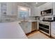 Kitchen featuring stainless steel appliances, tile backsplash, and ample cabinet space at 503 20Th Ave. N # 15-A, North Myrtle Beach, SC 29582