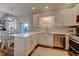 Bright kitchen with stainless steel appliances, white cabinets, countertops and a large island at 503 20Th Ave. N # 15-A, North Myrtle Beach, SC 29582