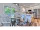 Bright kitchen with a large island, white cabinets, stainless appliances, and a breakfast table at 503 20Th Ave. N # 15-A, North Myrtle Beach, SC 29582