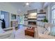 Inviting living room with a fireplace, decorative shelves, and an open view of the front door and staircase at 503 20Th Ave. N # 15-A, North Myrtle Beach, SC 29582