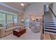 Bright living room featuring a plush sofa, hardwood floors, and an open layout leading to the kitchen at 503 20Th Ave. N # 15-A, North Myrtle Beach, SC 29582