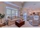 Cozy living room with a comfortable sofa, large window, and an open concept layout leading to the kitchen at 503 20Th Ave. N # 15-A, North Myrtle Beach, SC 29582