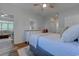 Relaxing main bedroom featuring a spacious bed, hardwood floors, and views into the living area at 503 20Th Ave. N # 15-A, North Myrtle Beach, SC 29582