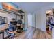 Office area with desk, organized shelving, and open closet and view to bath and hall at 503 20Th Ave. N # 15-A, North Myrtle Beach, SC 29582