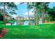 Scenic view of condos reflecting in a tranquil pond surrounded by lush greenery at 503 20Th Ave. N # 15-A, North Myrtle Beach, SC 29582