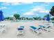 Large community pool with lounge chairs and tables under a bright blue sky at 503 20Th Ave. N # 15-A, North Myrtle Beach, SC 29582