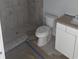 Bathroom featuring tiled shower and new fixtures at 507 Hillside Dr. N, North Myrtle Beach, SC 29582