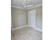 Cozy bedroom with neutral paint, ceiling fan and a spacious closet at 507 Hillside Dr. N, North Myrtle Beach, SC 29582